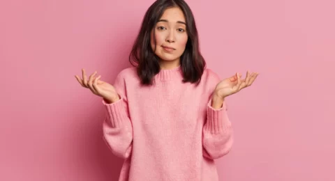 life-perception-hard-decision-concept-puzzled-clueless-young-asian-woman-spreads-palms-poses-uncertian-indoor-expresses-doubt-wears-knitted-sweater